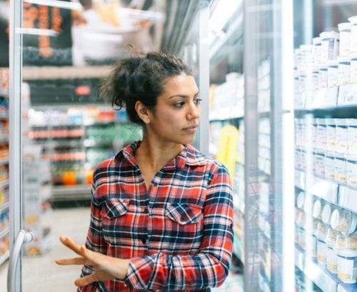 Woman shopping for yoghurt