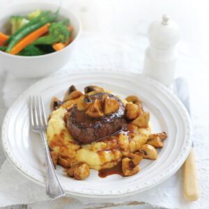 Beef and mushrooms on creamy polenta