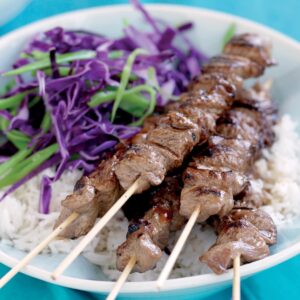 Teriyaki beef skewers with cabbage salad