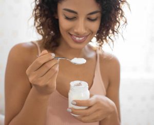 Woman eating yoghurt