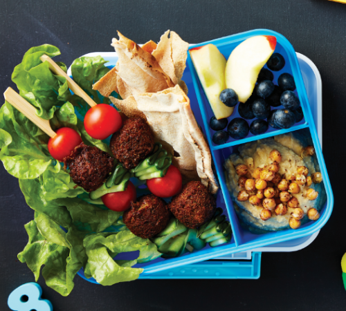 Falafel kebabs with pita chips, hummus & fruit